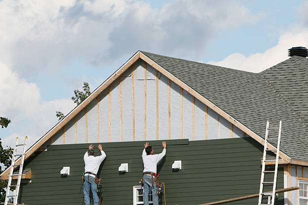 Professional Vinyl Siding technician working in Wayland, MA